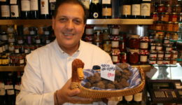 Roberto Persiani holding black truffles in E Volpetti. Yes, those are priced at 890 euros a kilo.