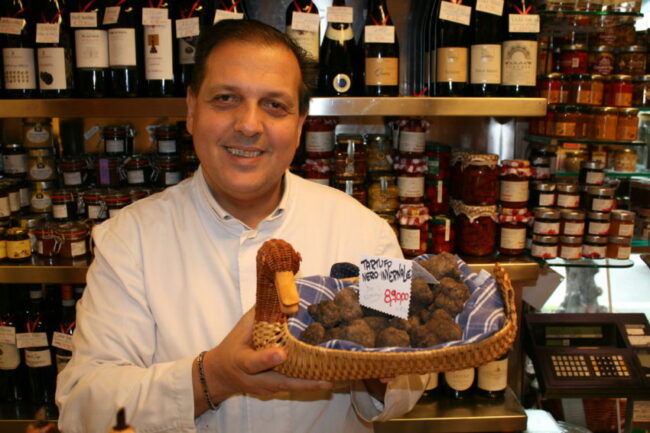 Roberto Persiani holding black truffles in E Volpetti. Yes, those are priced at 890 euros a kilo.