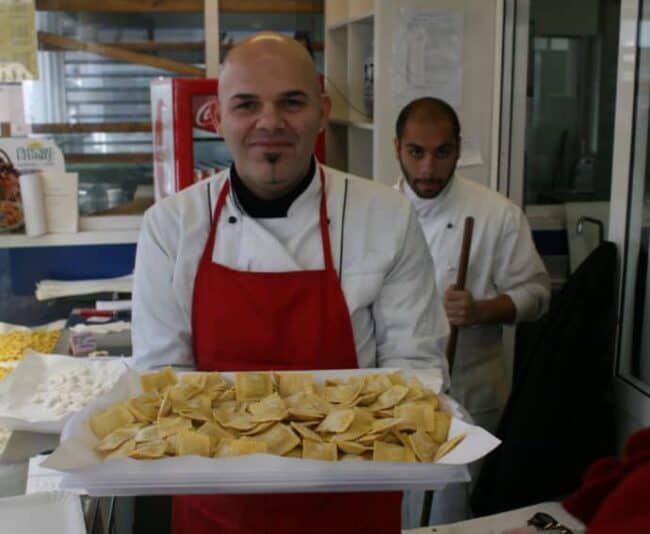 Alessandro holds stuffed ravioli in one of the 100-plus stalls in Rome's Mercato Testaccio.