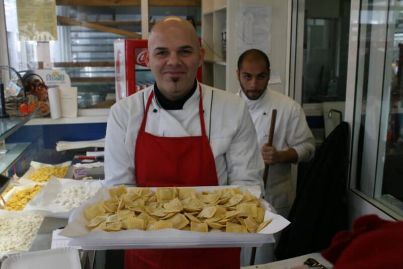 Alessandro holds stuffed ravioli in one of the 100-plus stalls in Rome's Mercato Testaccio.