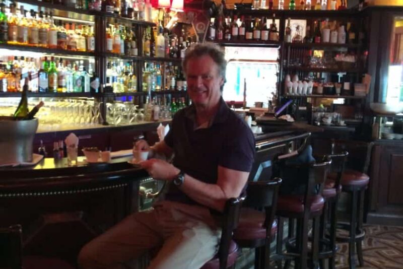 Me in Ernest Hemingway's designated seat at Closerie des Lilas in Paris' Montparnasse district.