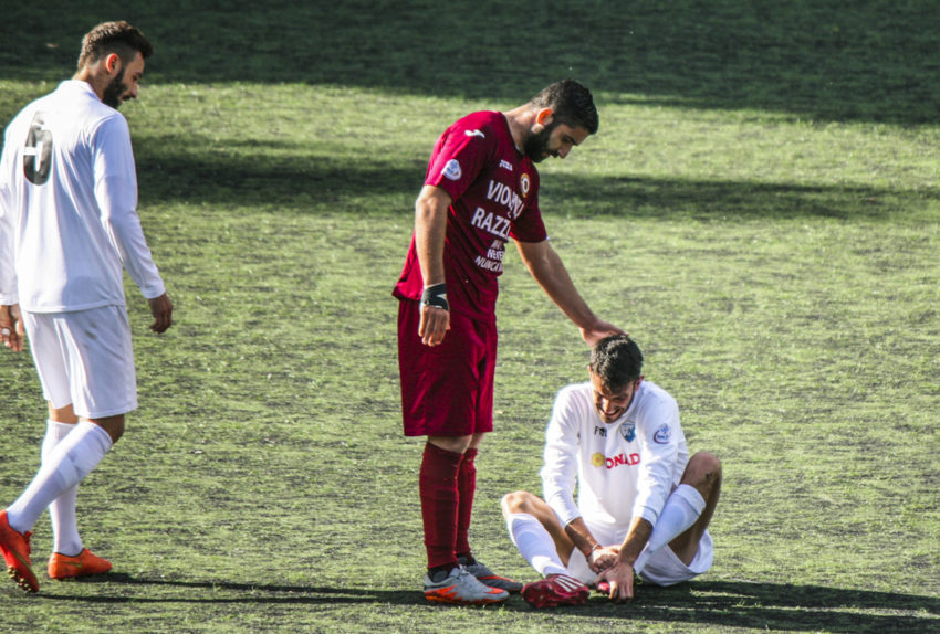 A Trastevere player checks on a Cynthia player faking an injury.