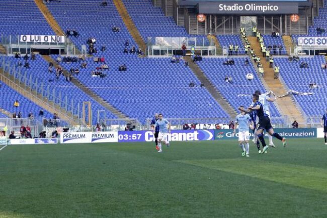 The crowd at one of last season's Lazio-Roma games at Olympic Stadium. Roma crowds have dropped from 64,271 in 2000-01 to 29,391 this season.