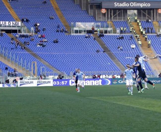The crowd at one of last season's Lazio-Roma games at Olympic Stadium. Roma crowds have dropped from 64,271 in 2000-01 to 29,391 this season.