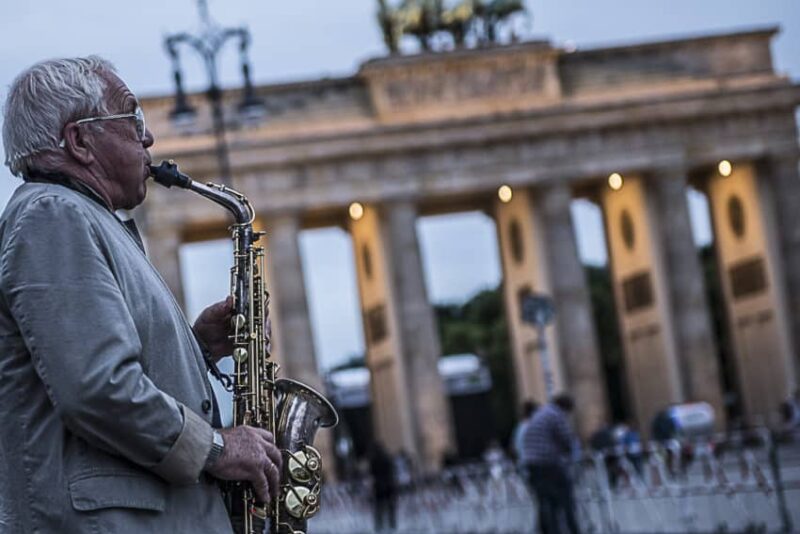 One of the many musicians in front of Brandenburg Gate, once the symbol of East-West division and now one of top attractions to 12 million visitors a year. Photo by Marina Pascucci
