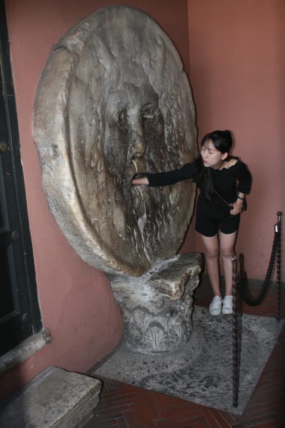 Tourists stand in line for ever to put their arm in the Bocca della Verita'.