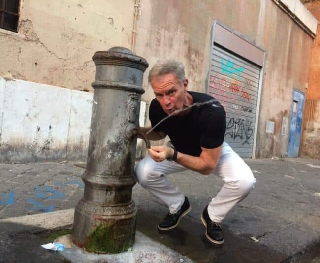 Me at one of the "nasone" in steaming Rome. The city has 2,500 of them but the water shortage has closed 400 of them.