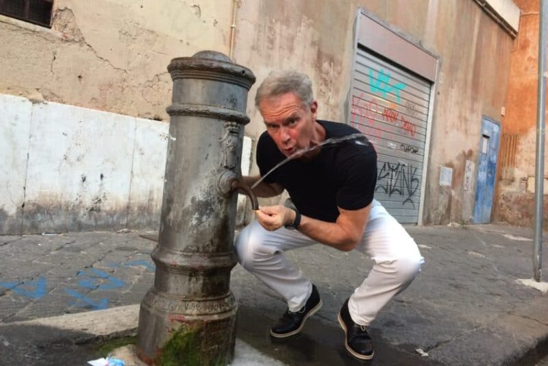 Me at one of the "nasone" in steaming Rome. The city has 2,500 of them but the water shortage has closed 400 of them.