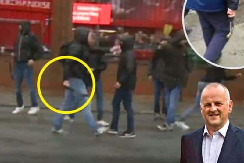 A hammer-wielding Roma fan approaches Liverpool fans April 24 in Liverpool. An attack left Liverpool fan Sean Cox in a coma. Times of London photo