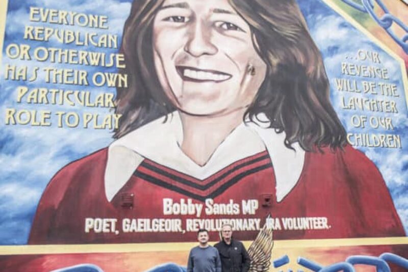 Patrick O'Byrne and I in front of the Bobby Sands mural on Belfast's Falls Road. Photo by Marina Pascucci