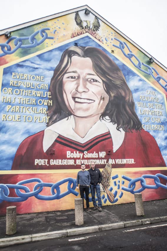 Patrick O'Byrne and I in front of the Bobby Sands mural on Belfast's Falls Road. Photo by Marina Pascucci