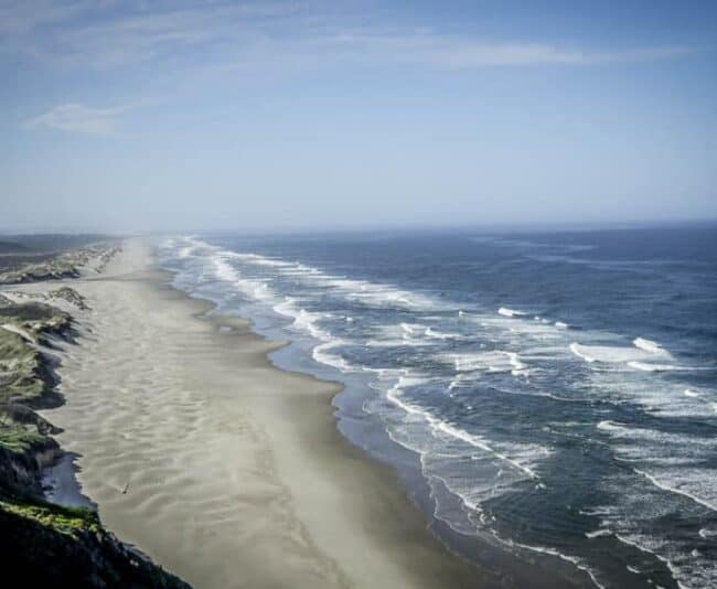 This wide stretch of unspoiled sandy beach south of Yachats can be seen all over the Oregon Coast. Photo by Marina Pascucci