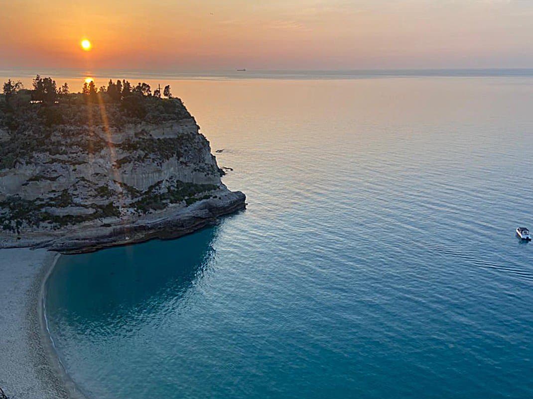 The sun sets behind the one-time island where Santa Maria dell'Isola has stood since the 7th century.