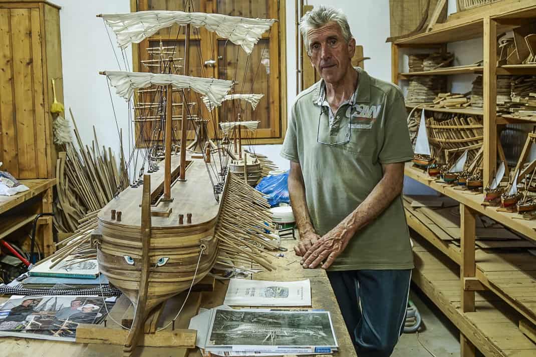 Yannis Bountalas stands in his shipbuilding workshop on the Greek island of Skopelos.