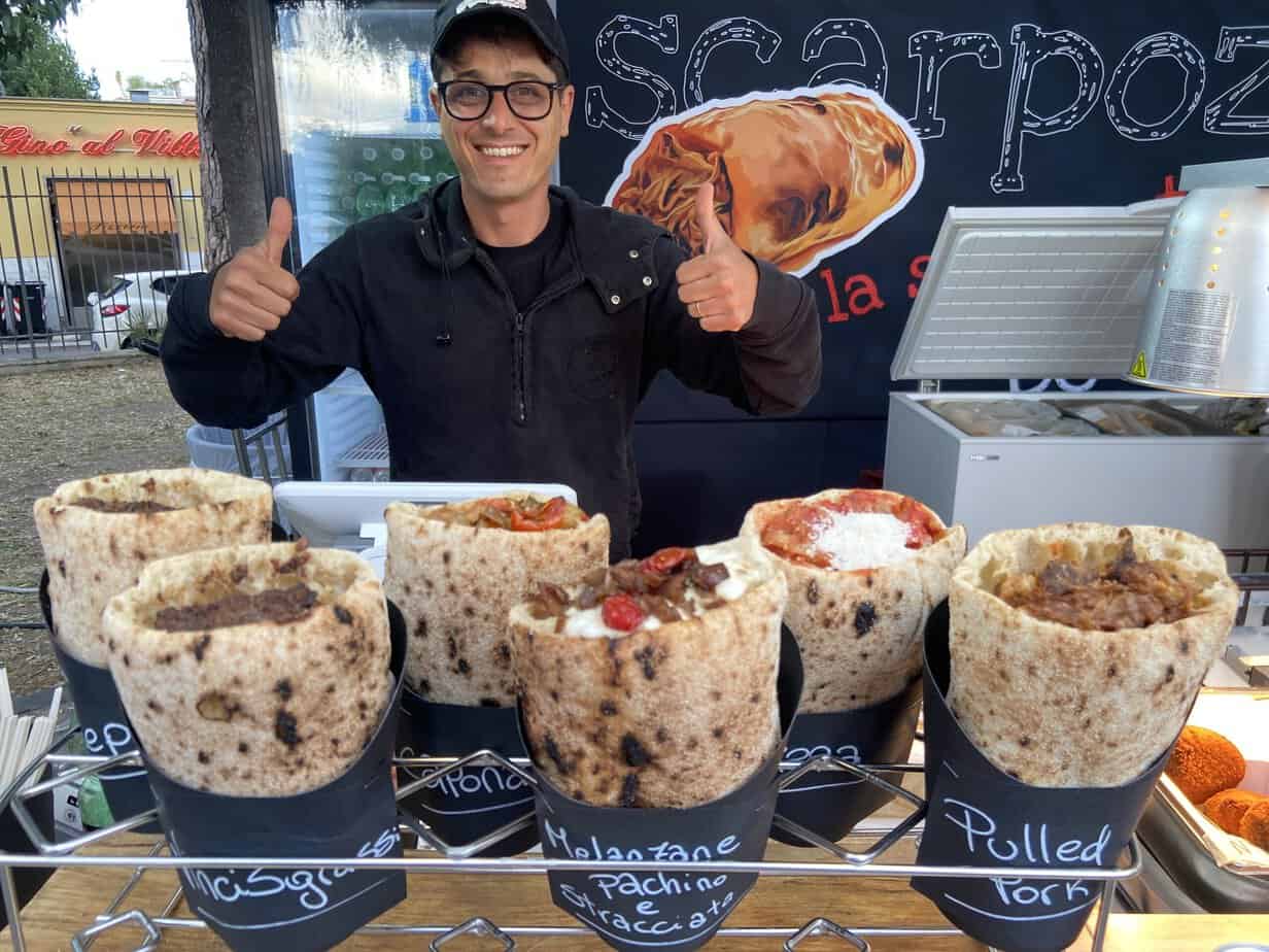 Juri Iacchelli stands behind Italian wraps in the food truck run by Agriturismo Colle dell'Acero.