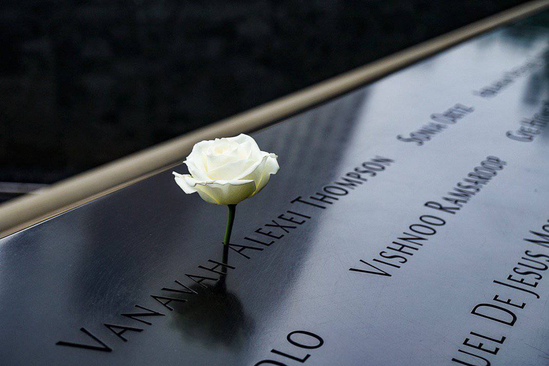 A rose sticks out from a name of one of the 2,983 terrorist attack victims at the Sept. 11 Memorial and Museum. 