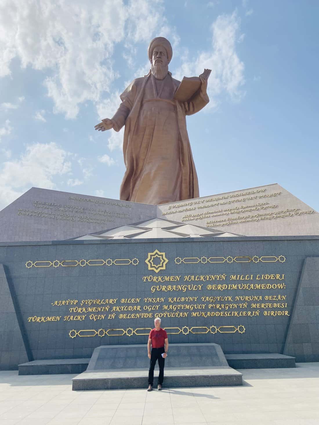 Me below the 60-meter statue of Magtymguly Pyragy, Turkmenistan’s famed poet.