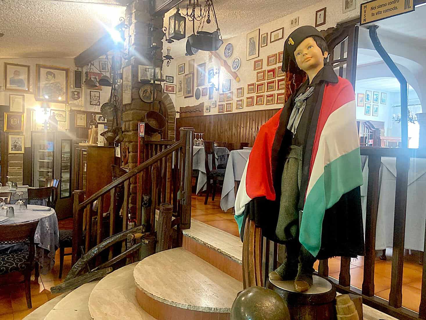 A mannequin with Italy's old fascist flag and Mussolini-style beret in Il Federale's front room.
