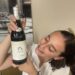 Michele Adriano lovingly looks at her Barolo wine at the Go Wine event in Rome.