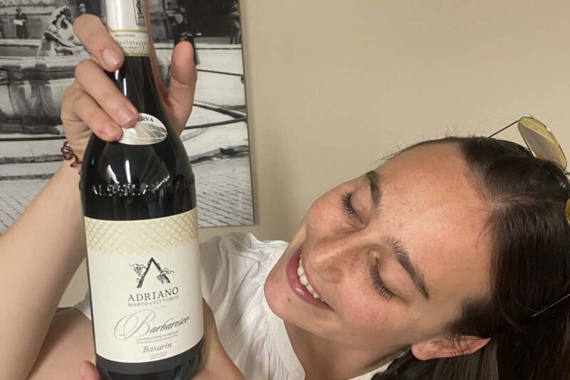 Michele Adriano lovingly looks at her Barolo wine at the Go Wine event in Rome.