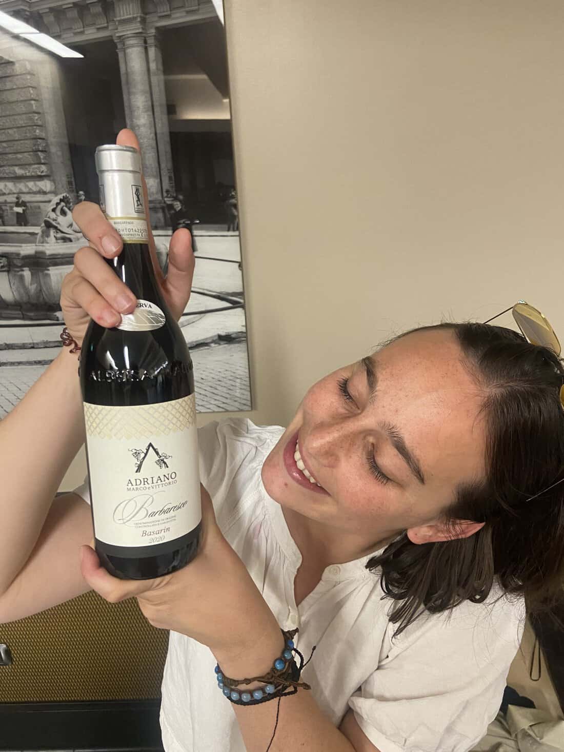 Michele Adriano lovingly looks at her Barolo wine at the Go Wine event in Rome.