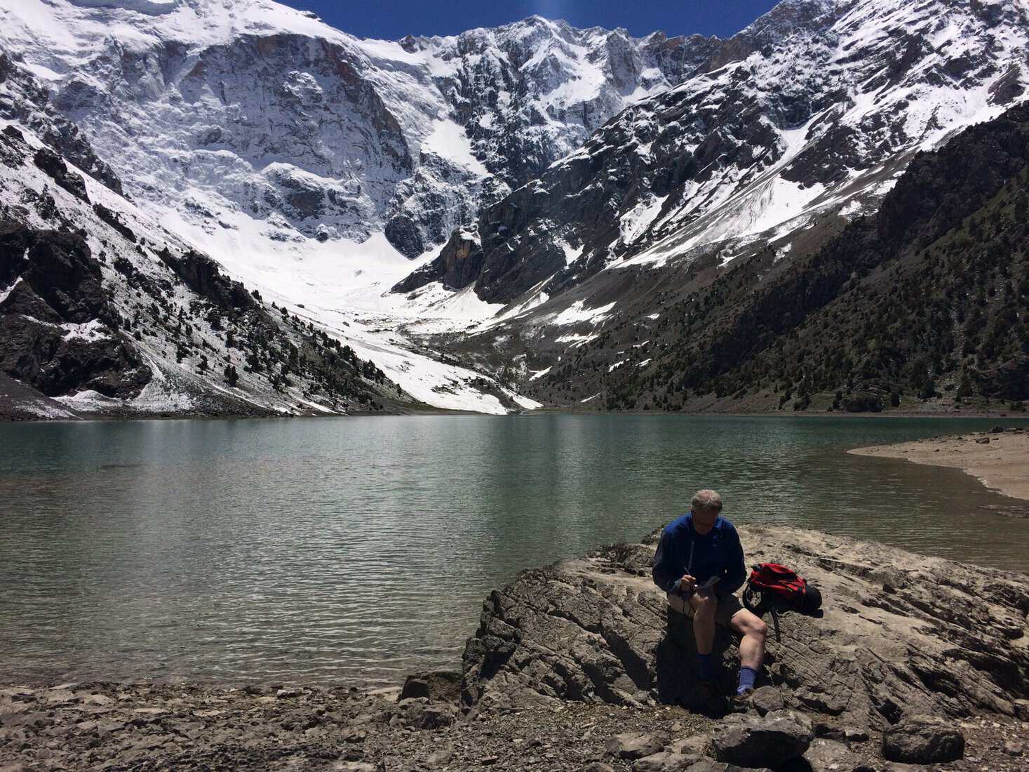 Me taking notes in Tajikistan's Fan Mountains.